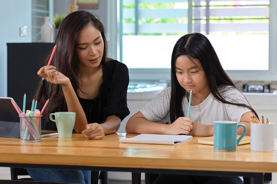 student and tutor together at a desk in Oxnard